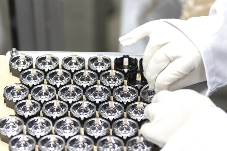 Packaging of LED optics and lenses